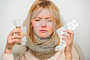 Getting fast relief. Ways to feel better fast. Headache and flu remedies. Get rid of flu. Woman wear warm scarf because