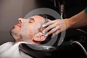 Getting hair washed in a salon photo