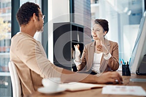 Getting her point across. Shot of two businesspeople having a discussion in an office.