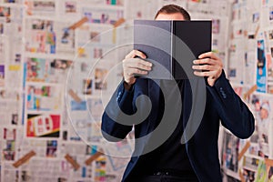 Getting information. Reading folder, folder on the chair.