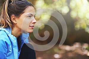 Getting psyched for her run. Shot of a woman out for a train run.