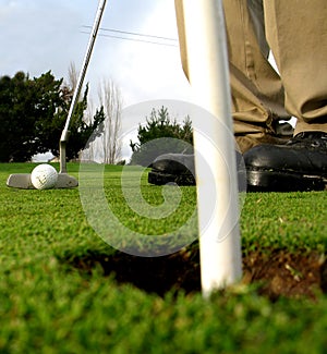 Getting ready to sink the putt photo