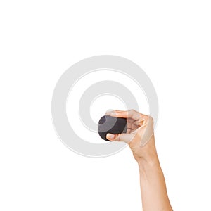 Getting rid of all that stress. Cropped view of a womans hand squeezing a stress ball against a white background.