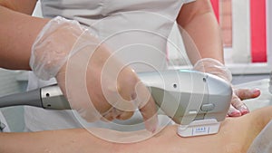 Getting slim body in beauty clinic doing SMAS-lifting ultrasonic procedure. Non-surgical arm skin lifting. Antiaging