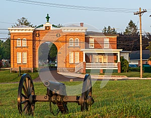 Gettysburg, Pennsylvania, USA August 27, 2021 A cannon on the battlefield in front of the gatehouse at the Evergreen Cemetery whic