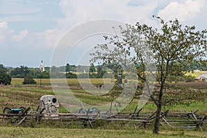 Gettysburg, Pennsylvania, USA August 27, 2021 A wooden fence, monuments and cannons on the battlefield at Gettysburg that was foug