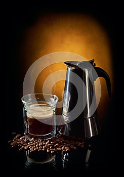 Geyser coffee maker and cup of black coffee