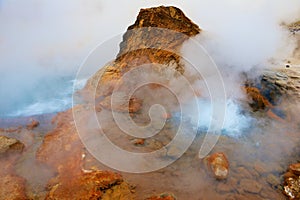 Geyser at the El Tatio geothermal field at sunrise, Chile.