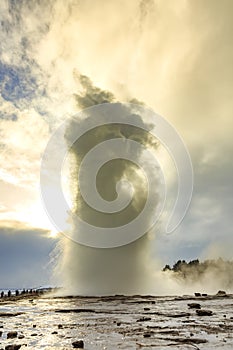 Geyser fountain discharges water at Strokkur Geysir, Iceland located at the golden circle route