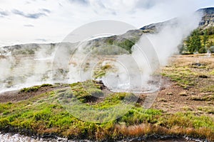 Geyser pool in Haukadalur valley in Iceland