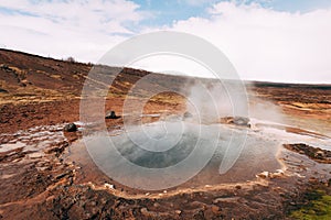 Geyser Valley in the southwest of Iceland. The famous tourist attraction Geysir. Geothermal zone Haukadalur. Strokkur