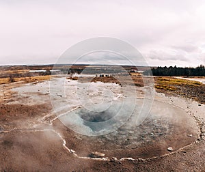 Geyser Valley in the southwest of Iceland. The famous tourist attraction Geysir. Geothermal zone Haukadalur. Strokkur