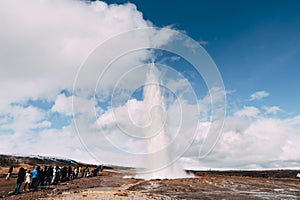 Geyser Valley in the southwest of Iceland. The famous tourist attraction Geysir. Geothermal zone Haukadalur. Tourists