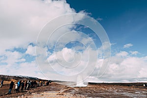 Geyser Valley in the southwest of Iceland. The famous tourist attraction Geysir. Geothermal zone Haukadalur. Tourists