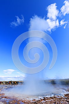 GEYSIR, ICELAND, 14 SEPTEMBER, 2019 : Erupting of the geysir. Tourists visiting the famous Geysir area