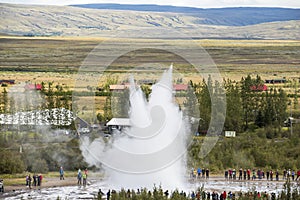 Geysir Strokkur in Iceland erupts with tall fountain