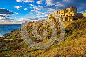 Ghajn Tuffeha, Malta - Golden hour at Ghajn Tuffieha beach on a lovely summer day with beautiful sky