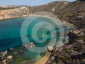 Ghajn Tuffieha Bay Malta Riviera beach aerial with beautiful rock formation in turquoise sea