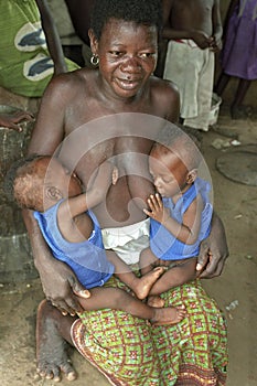 Ghanaian Mother breastfeeding twins