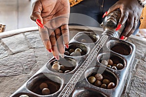 A Ghanaian woman with a blank hand