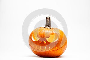 Ghastly Halloween pumpkin head jack lantern with burning candles on white background