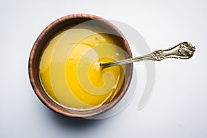 Indian or desi ghee or pure ghee served in a wooden bowl