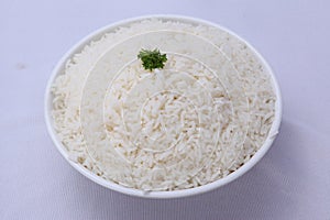 ghee rice. nei choru. kaima rice.jeerakasala rice. in a white bowl on white background with the garnish