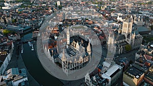 Ghent Belgium Aerial Flying over downtown area with church cityscape views at sunset time - October 2022