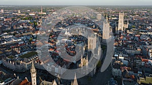 Ghent Belgium Aerial Flying over downtown area with church cityscape views at sunset time - October 2022