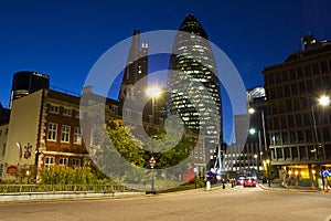 Gherkin and a street in London at night