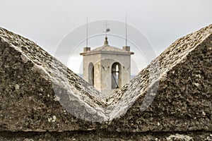 Ghibelline merlon with the tower view in San Marino, the battlement with merlons in castle