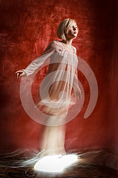 Ghost digital girl on red grunge wall