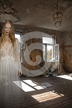 Ghost of a girl in a room of an old abandoned house