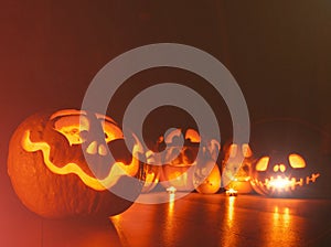 Ghost pumpkins on Halloween. ead Jack on Dark background. Holiday indoor decorations.