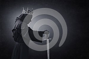 Ghost of a queen or king with medieval sword photo