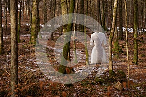 Ghost sculpture in forest