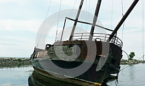 Ghost ship stuck on the rocks