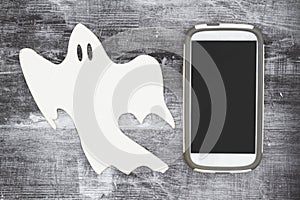 Ghosting someone online message with a white ghost and cell phone