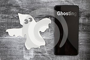 Ghosting someone online message with a white ghost and cell phone