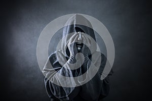 Ghostly figure in hooded cloak