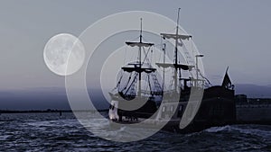 Ghostly pirate ship sailing towards horizon in endless blue ocean, moon in sky