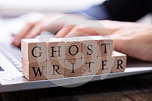 Ghostwriter Wooden Block On Computer Keyboard
