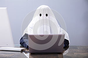 Ghostwriter Writing Article On Laptop