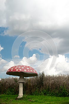 Giant artificial fly agaric at blue sky
