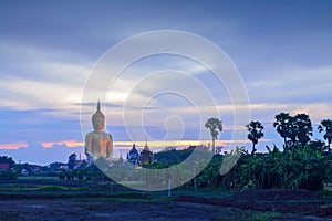 Giant big Buddha statue in Thailand at twilight time