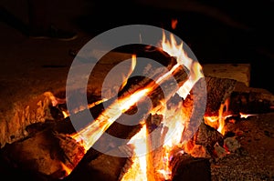 Giant bon fire lit for the festival of Lohri surrounded by people