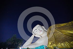 Giant buddha sculpture at night