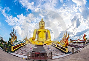 A giant Buddha statue looks out over downtown Thailand at sunset from Bongeunsa Temple.