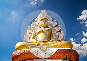 Giant Buddhawith Naga serpent temple in Singburi, Thailand