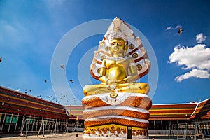 Giant Buddhawith Naga serpent temple in Singburi, Thailand